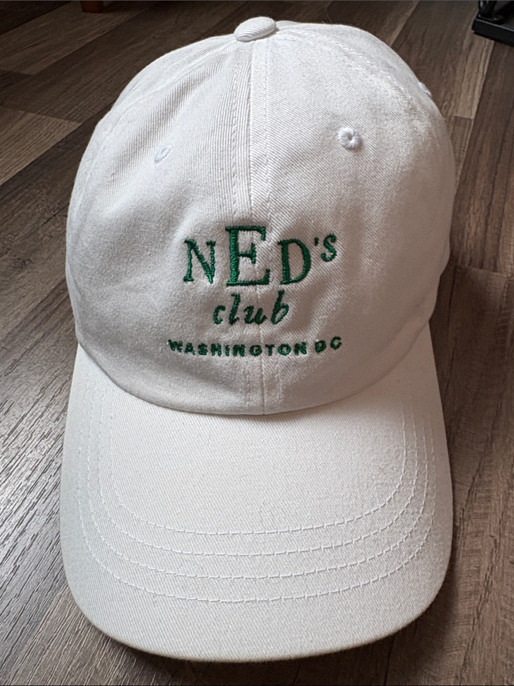 The Classic White Baseball Cap with Green Embroidered 'NED's club'